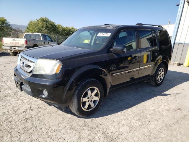 HONDA PILOT TOUR 2010 with VIN 5FNYF4H89AB012833 - Photo from auction