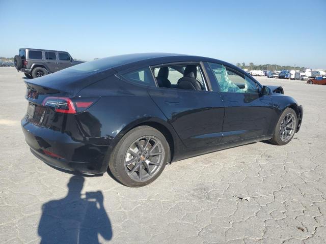 Снимка 3 от търг – 2021 TESLA MODEL 3 с VIN 5YJ3E1EA5MF047652