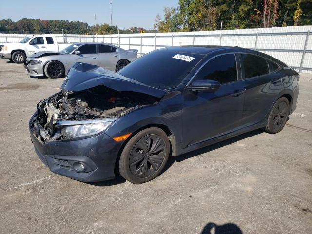 HONDA CIVIC EXL 2018 with VIN JHMFC1F74JX041153 - Photo from auction