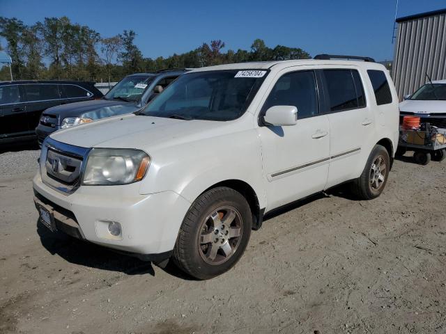 HONDA PILOT TOUR 2011 with VIN 5FNYF3H9XBB057946 - Photo from auction
