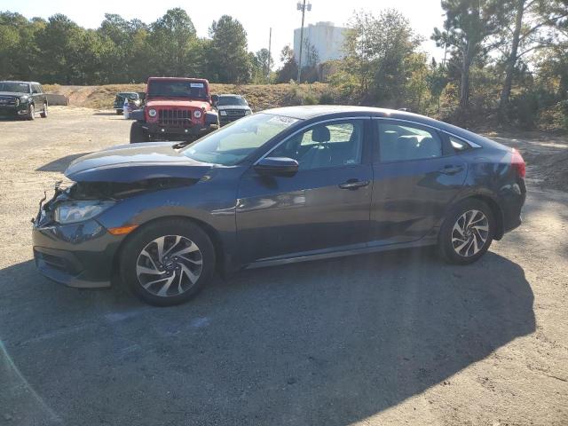 HONDA CIVIC EX 2018 with VIN 19XFC2F74JE040060 - Photo from auction