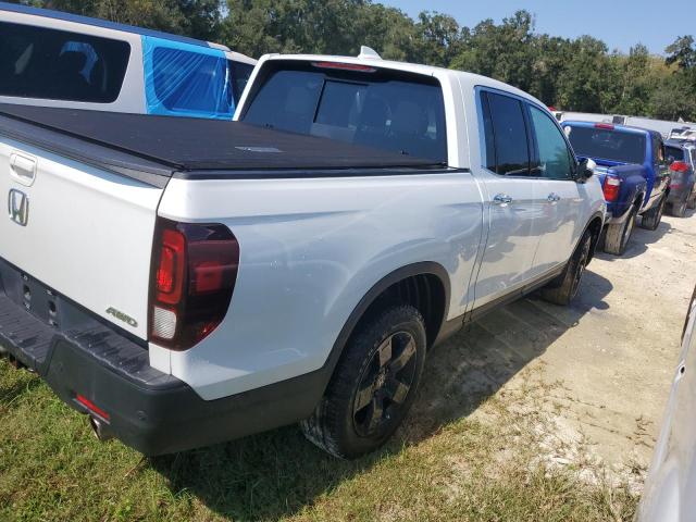 Photo 3 from auction – 2022 HONDA RIDGELINE with VIN 5FPYK3F77NB022290