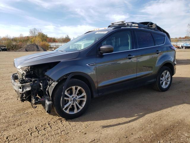 FORD ESCAPE SE 2018 with VIN 1FMCU9GDXJUD35397 - Photo from auction