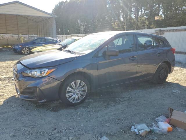 SUBARU IMPREZA 2017 with VIN 4S3GTAA64H3751515 - Photo from auction