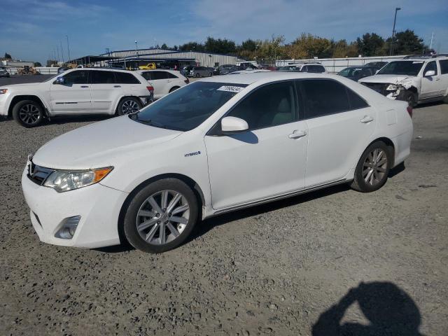 TOYOTA CAMRY HYBR 2014 with VIN 4T1BD1FK1EU136306 - Photo from auction