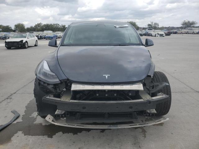 Photo 5 from auction – 2023 TESLA MODEL Y with VIN 7SAYGDED9PF965231
