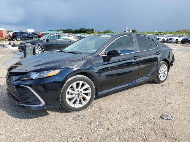 TOYOTA CAMRY LE 2023 with VIN 4T1C11AK2PU809840 - Photo from auction