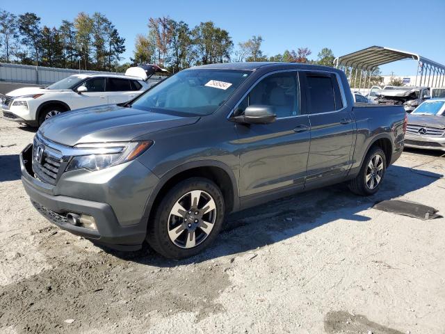 HONDA RIDGELINE 2017 with VIN 5FPYK2F59HB002037 - Photo from auction