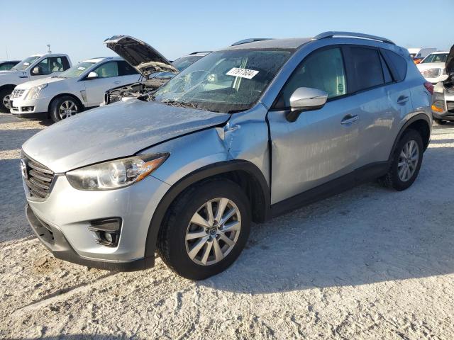 MAZDA CX-5 TOURI 2016 with VIN JM3KE2CY4G0638521 - Photo from auction