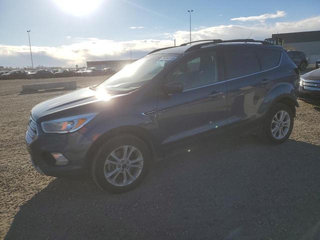 FORD ESCAPE SE 2018 with VIN 1FMCU9GD0JUB32647 - Photo from auction