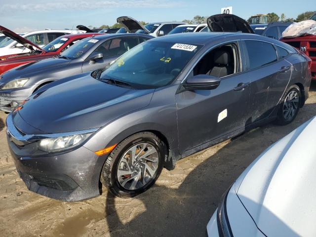 HONDA CIVIC EX 2018 with VIN 2HGFC2F71JH596056 - Photo from auction
