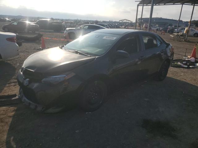 TOYOTA COROLLA L 2019 with VIN 5YFBURHE3KP935670 - Photo from auction