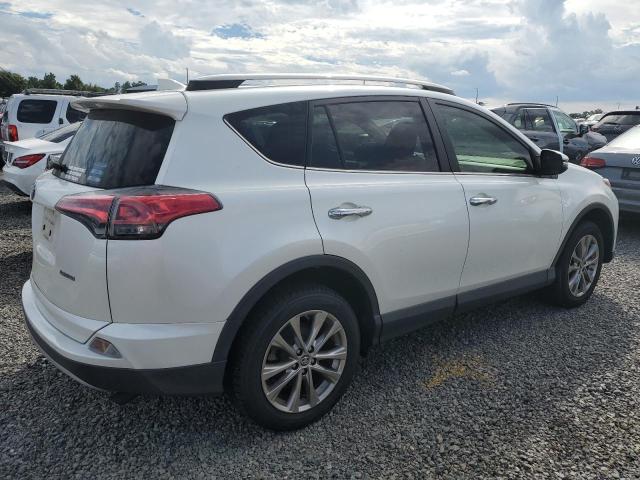 Photo 3 from auction – 2018 TOYOTA RAV4 LIMIT with VIN JTMYFREV4JD109338