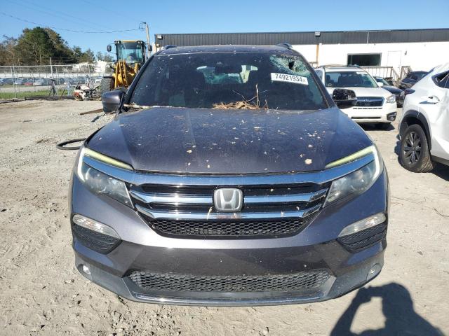 Photo 5 from auction – 2016 HONDA PILOT TOUR with VIN 5FNYF5H93GB057144
