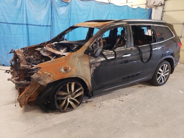 HONDA PILOT TOUR 2017 with VIN 5FNYF6H91HB073950 - Photo from auction