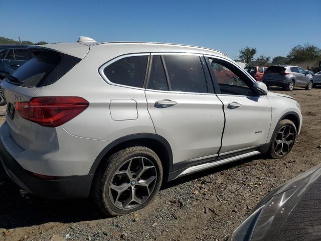 Photo 3 from auction – 2017 BMW X1 XDRIVE2 with VIN WBXHT3C30H5F75110