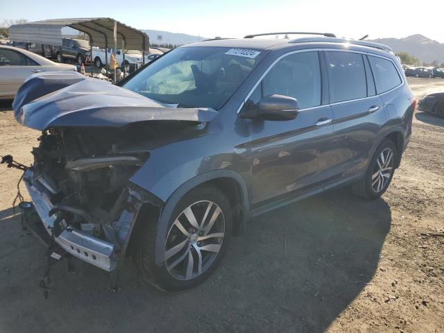 HONDA PILOT TOUR 2016 with VIN 5FNYF5H96GB045490 - Photo from auction