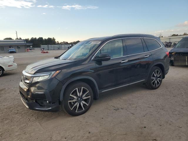 HONDA PILOT TOUR 2022 with VIN 5FNYF5H65NB022897 - Photo from auction