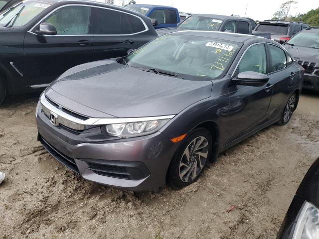 HONDA CIVIC EX 2018 with VIN 19XFC2F7XJE035803 - Photo from auction