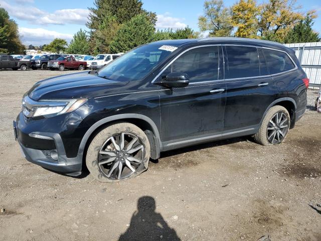 HONDA PILOT TOUR 2020 with VIN 5FNYF6H67LB003609 - Photo from auction