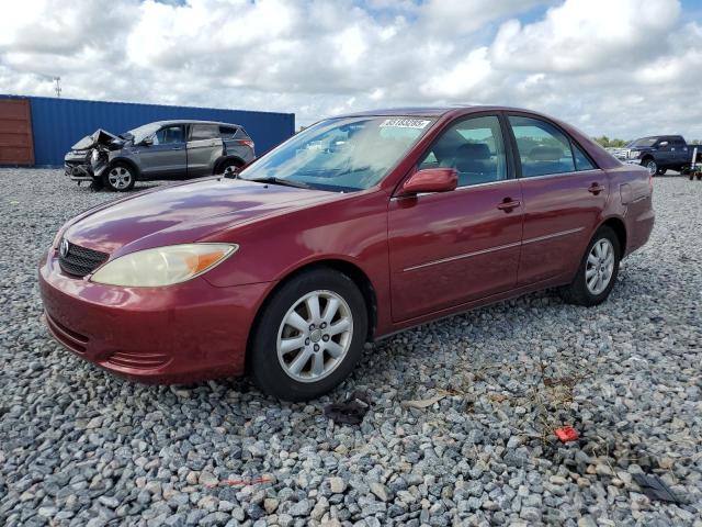TOYOTA CAMRY LE 2002 with VIN JTDBE30KX20043518 - Photo from auction