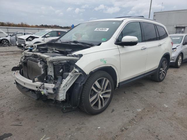 HONDA PILOT TOUR 2017 with VIN 5FNYF6H91HB032864 - Photo from auction