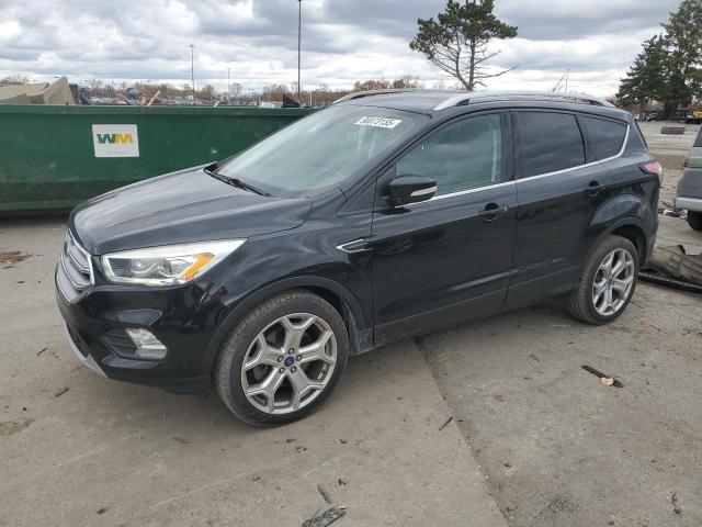 FORD ESCAPE 2017 with VIN 1FMCU9J93HUE06261 - Photo from auction