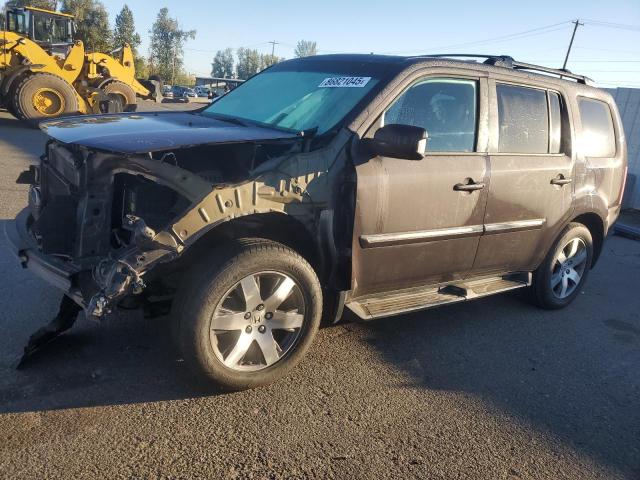 HONDA PILOT TOUR 2014 with VIN 5FNYF4H95EB046380 - Photo from auction