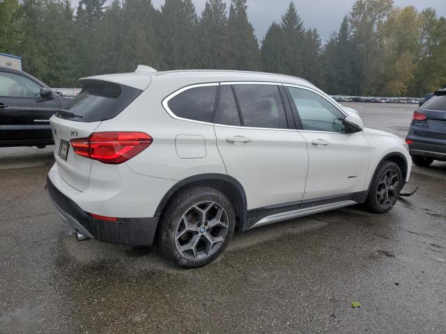 Photo 3 from auction – 2017 BMW X1 XDRIVE2 with VIN WBXHT3Z35H4A55028