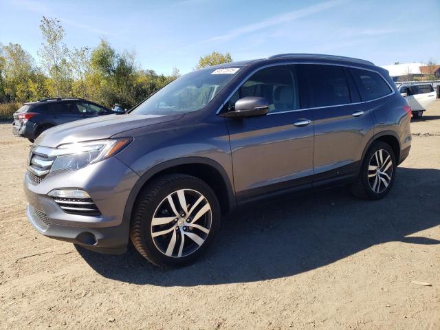 HONDA PILOT TOURING 2017 with VIN 5FNYF6H95HB054723 - Photo from auction