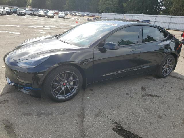 TESLA MODEL 3 2021 with VIN 5YJ3E1EAXMF875129 - Photo from auction