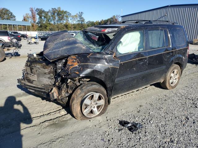 HONDA PILOT EXL 2011 with VIN 5FNYF3H59BB028368 - Photo from auction