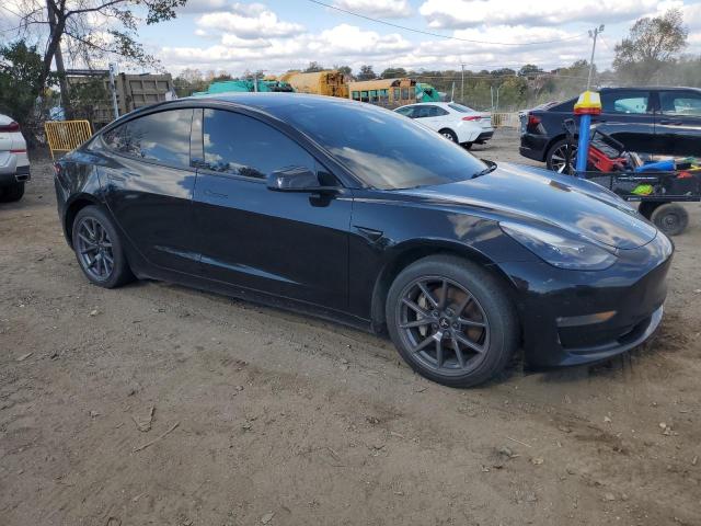 Photo 4 from auction – 2021 TESLA MODEL 3 with VIN 5YJ3E1EBXMF053438