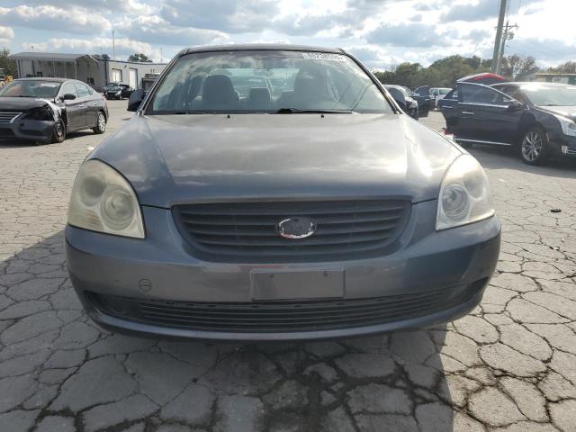 Photo 5 from auction – 2006 KIA OPTIMA LX with VIN KNAGE124565028343