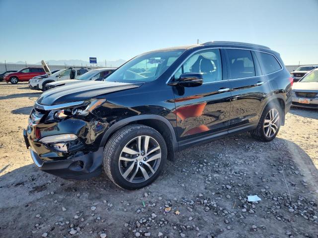 HONDA PILOT TOUR 2017 with VIN 5FNYF6H98HB054439 - Photo from auction