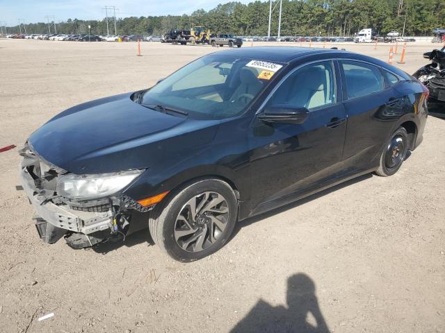 HONDA CIVIC EX 2018 with VIN 19XFC2F72JE017571 - Photo from auction