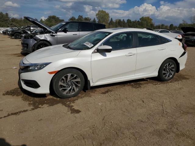 HONDA CIVIC EX 2018 with VIN 19XFC2F70JE017052 - Photo from auction