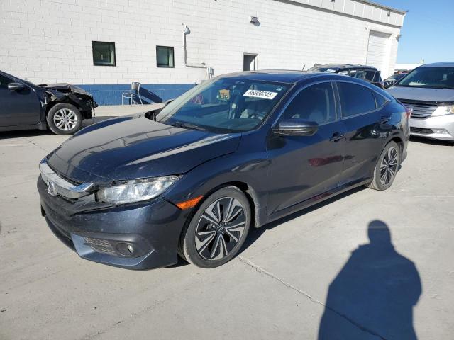 HONDA CIVIC EX 2018 with VIN JHMFC1F32JX004552 - Photo from auction