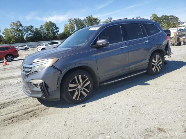 HONDA PILOT TOURING 2016 with VIN 5FNYF5H92GB001650 - Photo from auction