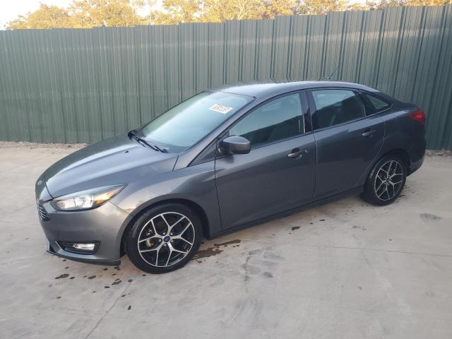 FORD FOCUS SE 2018 with VIN 1FADP3FE2JL219999 - Photo from auction