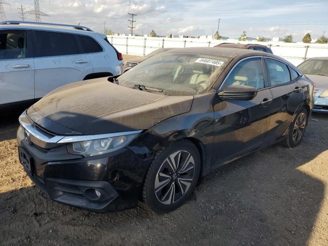 HONDA CIVIC EXL 2017 with VIN 19XFC1F74HE011050 - Photo from auction