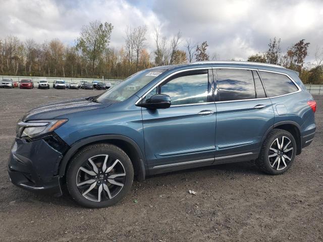 HONDA PILOT TOURING 2021 with VIN 5FNYF6H67MB080353 - Photo from auction