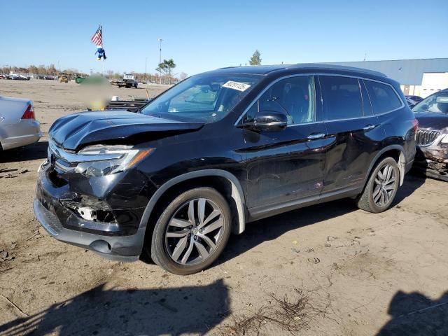 Photo 1 from auction – 2017 HONDA PILOT TOUR with VIN 5FNYF6H99HB097543
