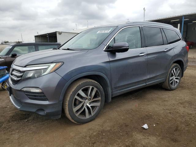 HONDA PILOT TOUR 2016 with VIN 5FNYF6H97GB122440 - Photo from auction