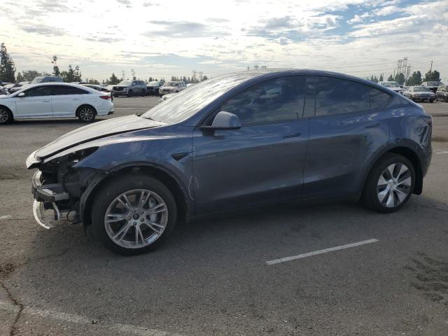 TESLA MODEL Y 2023 with VIN 7SAYGDEE8PA208097 - Photo from auction