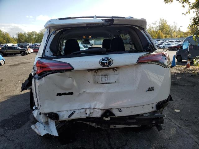 Photo 6 from auction – 2018 TOYOTA RAV4 LE with VIN 2T3BFREV9JW724928