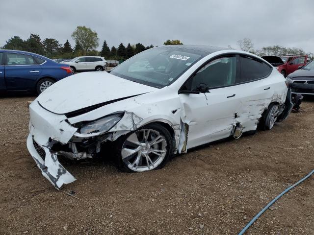 TESLA MODEL Y 2023 with VIN 7SAYGAEE1PF593990 - Photo from auction