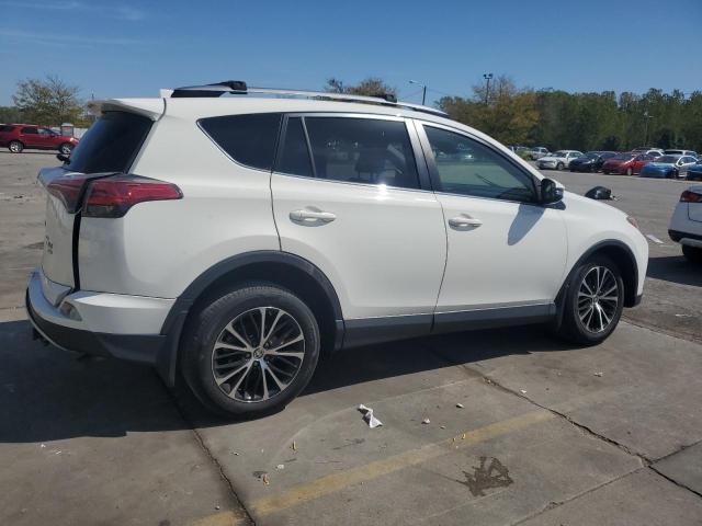 Photo 3 from auction – 2017 TOYOTA RAV4 XLE with VIN JTMRFREV5HJ706384