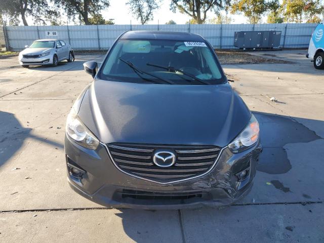 Photo 5 from auction – 2016 MAZDA CX-5 TOURI with VIN JM3KE2CY9G0880916