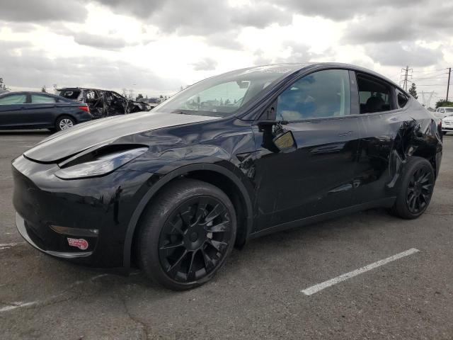 TESLA MODEL Y 2023 with VIN 7SAYGDEE8PF809061 - Photo from auction